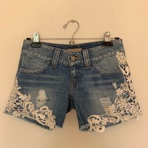 GUESS Lace cut off shorts